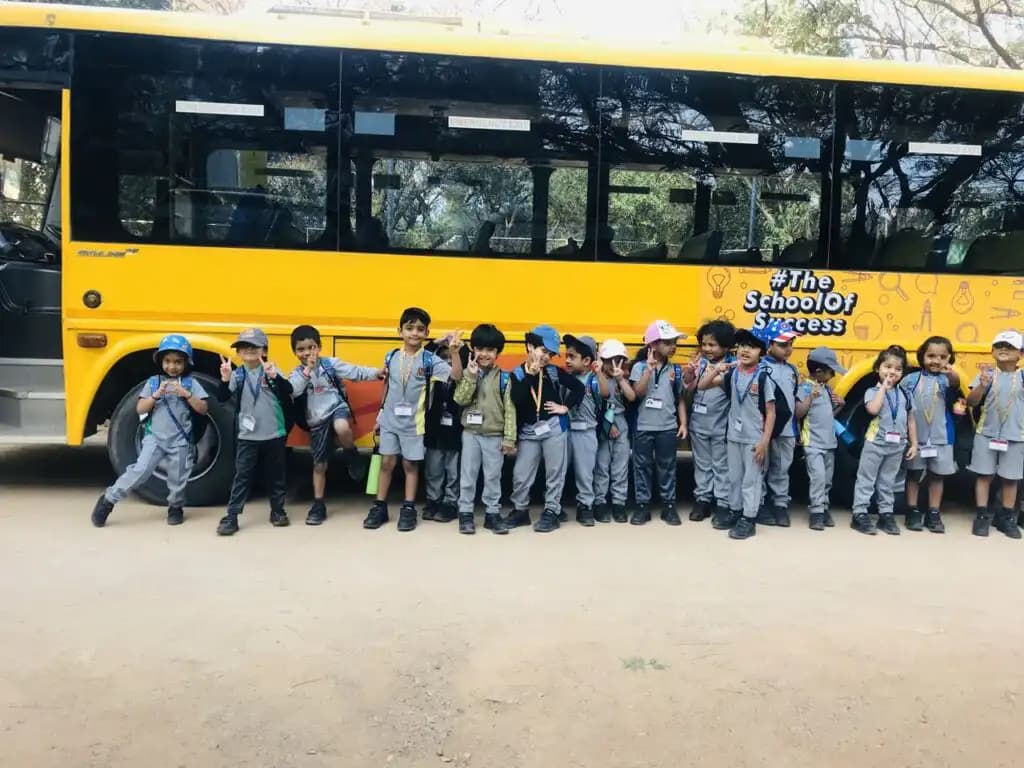 A group of Suchitra pupils together beside the school bus
